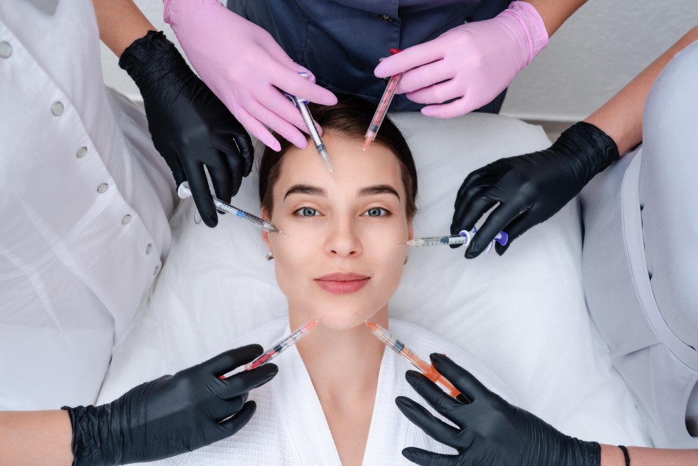 Woman receiving multiple dermal filler injections