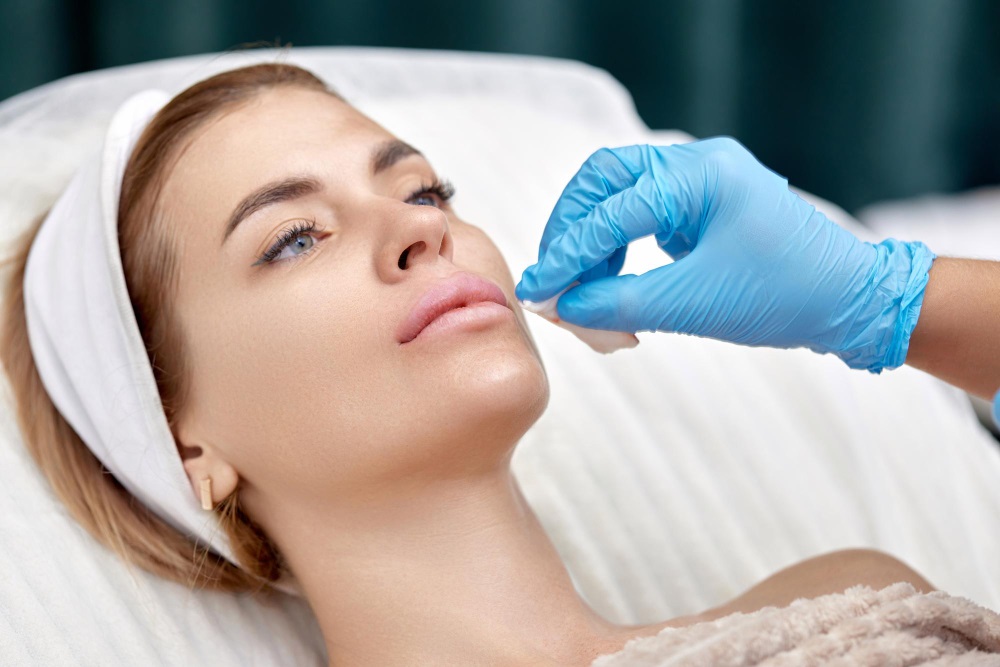 Woman undergoing lip augmentation procedure